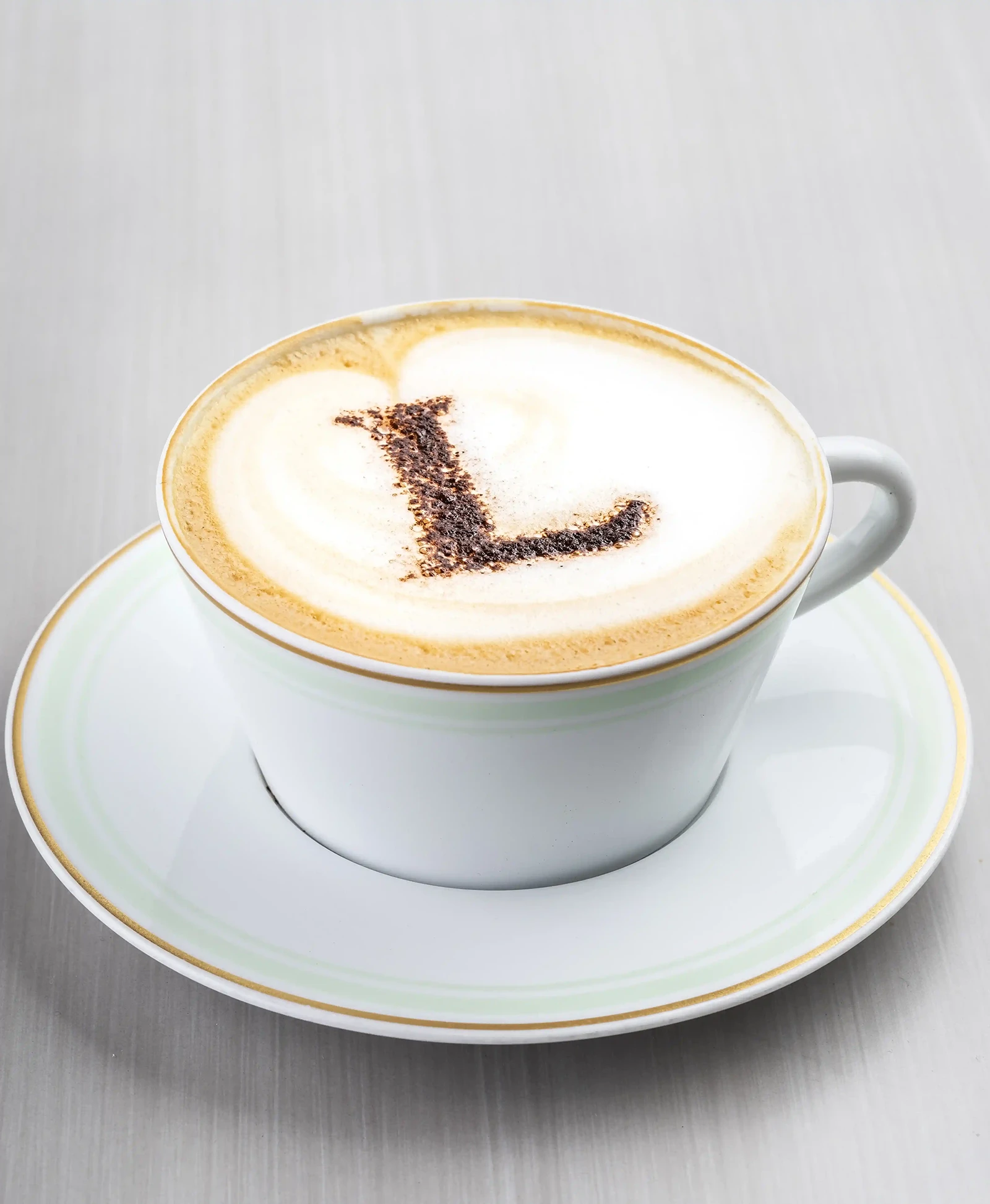 A classic cappuccino with a frothy layer of milk foam on top.