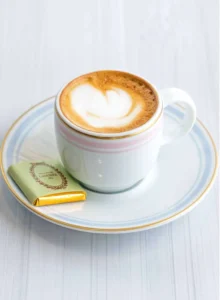 A small glass of espresso cut with a small amount of warm milk.