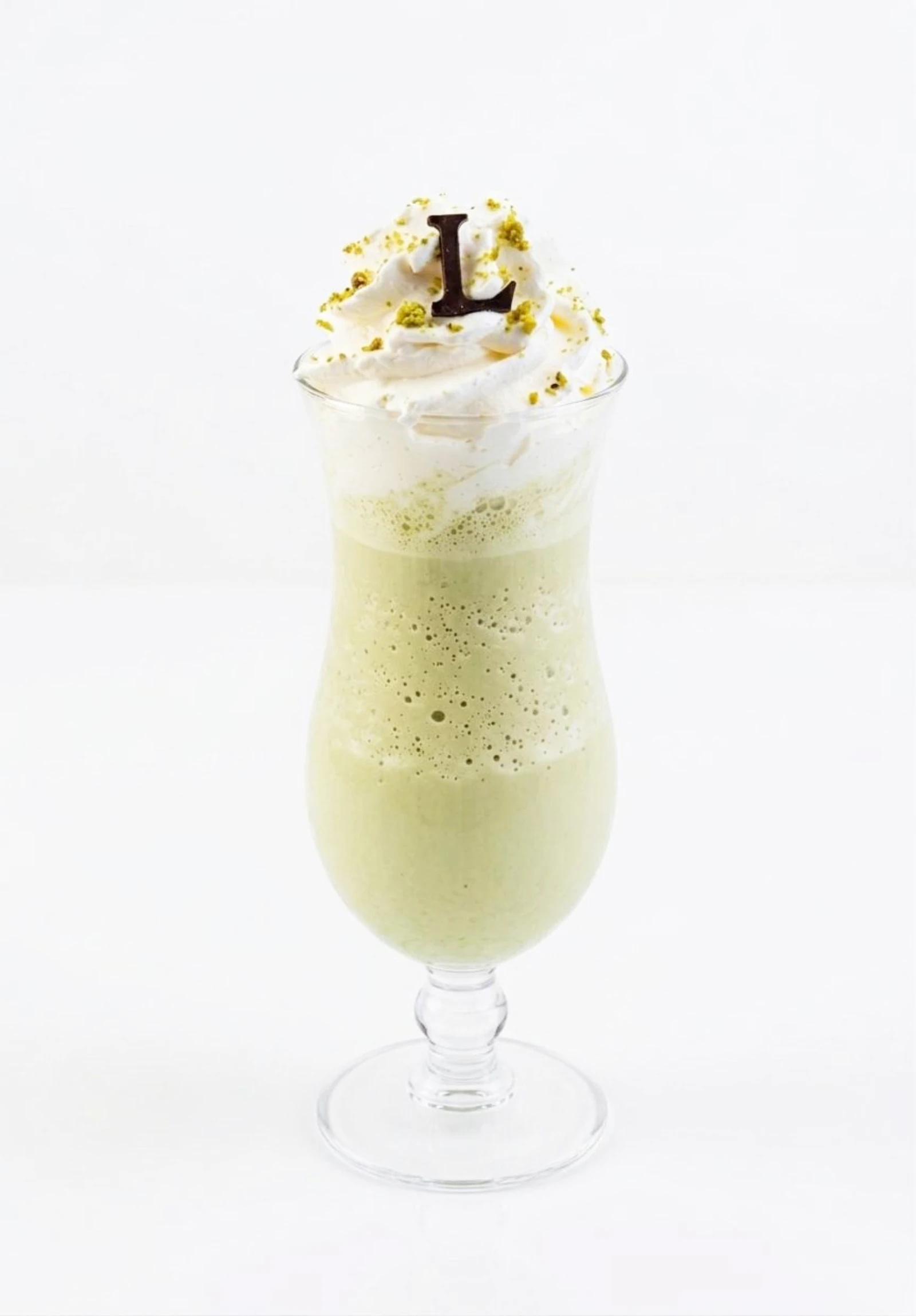 Pistachio Café Frappe blended with espresso, milk and Sicilian pistachio, topped with whipped cream and crushed pistachio
