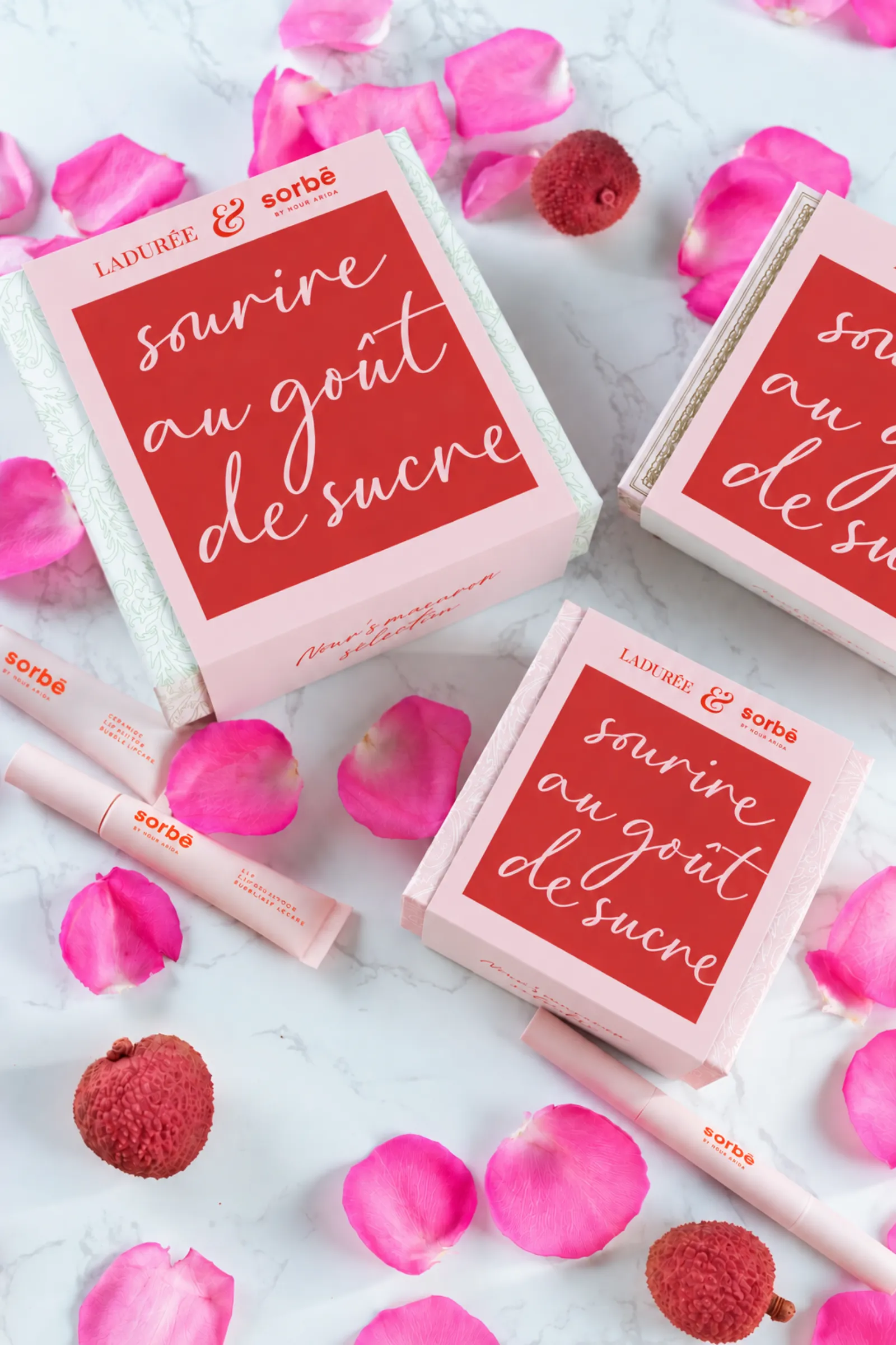 Ladurée and Sorbé lip care boxes with rose petals